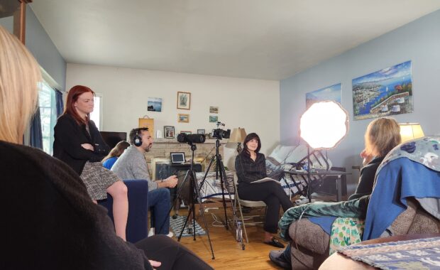 A video crew films a woman in her home