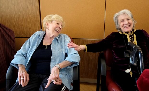 two older women laughing together