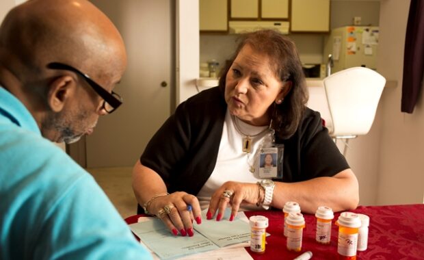 man and women sitting at desk